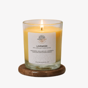 Scented beeswax candle in a glass container